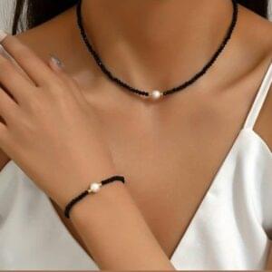 Minimalist black bracelet and necklace set featuring a white pearl. Handmade, elegant, and perfect for teenage girls' everyday style or gifting.